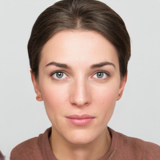 Neutral white young-adult female with medium  brown hair and grey eyes