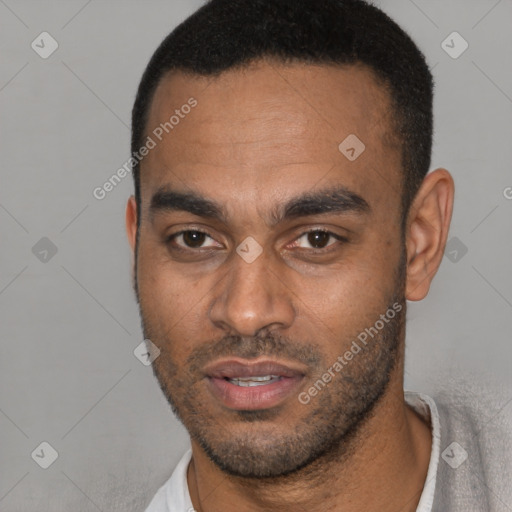 Joyful latino young-adult male with short  black hair and brown eyes