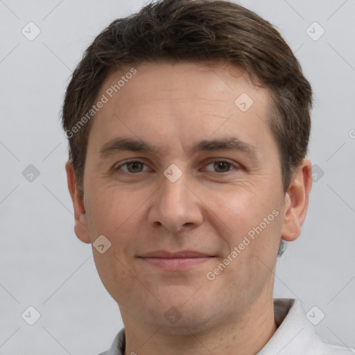 Joyful white adult male with short  brown hair and brown eyes