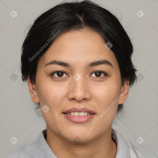 Joyful asian young-adult female with medium  brown hair and brown eyes