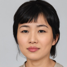 Neutral asian young-adult female with medium  black hair and brown eyes