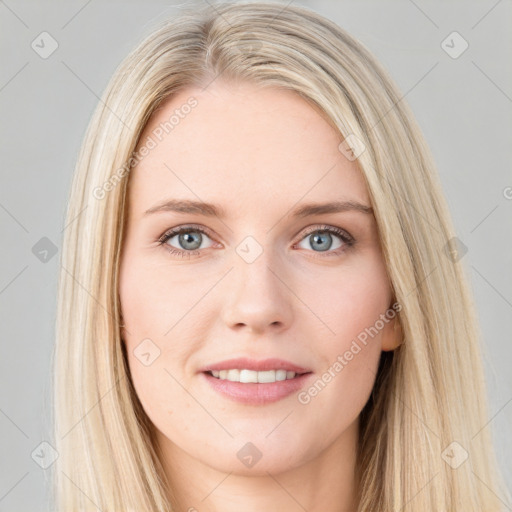 Joyful white young-adult female with long  brown hair and blue eyes