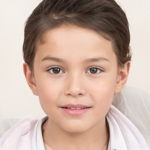 Joyful white child female with short  brown hair and brown eyes