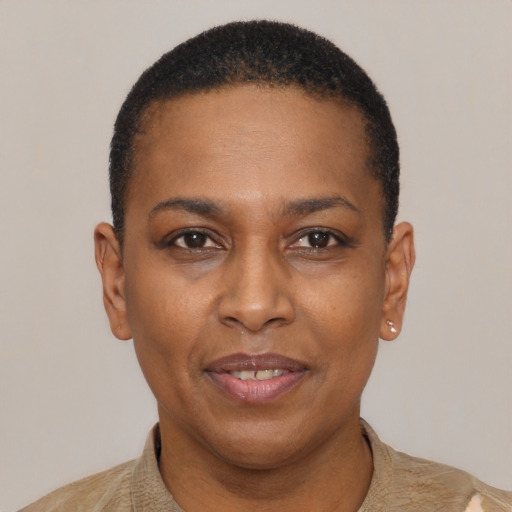 Joyful black adult female with short  black hair and brown eyes