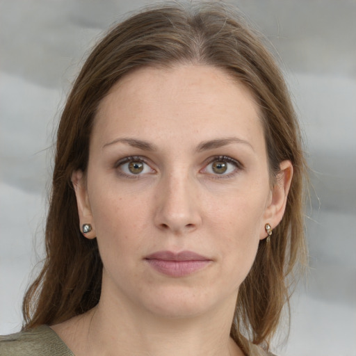 Joyful white young-adult female with medium  brown hair and grey eyes