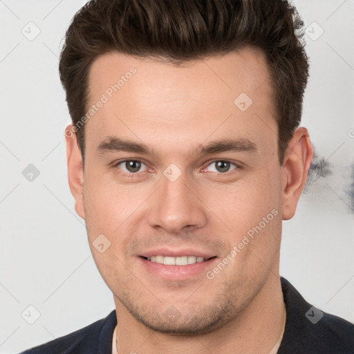 Joyful white young-adult male with short  brown hair and brown eyes