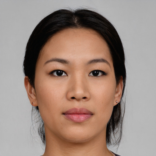 Joyful asian young-adult female with medium  black hair and brown eyes