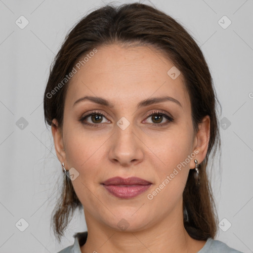 Joyful white adult female with medium  brown hair and brown eyes