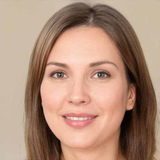 Joyful white young-adult female with long  brown hair and brown eyes