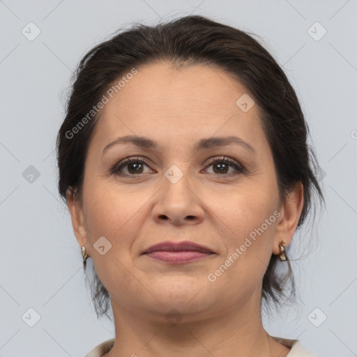 Joyful white adult female with medium  brown hair and brown eyes