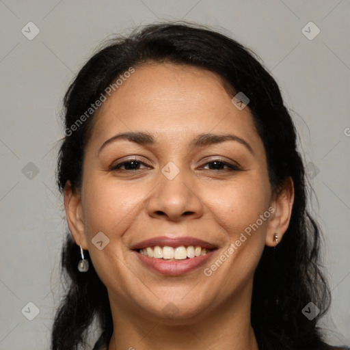 Joyful latino adult female with medium  brown hair and brown eyes