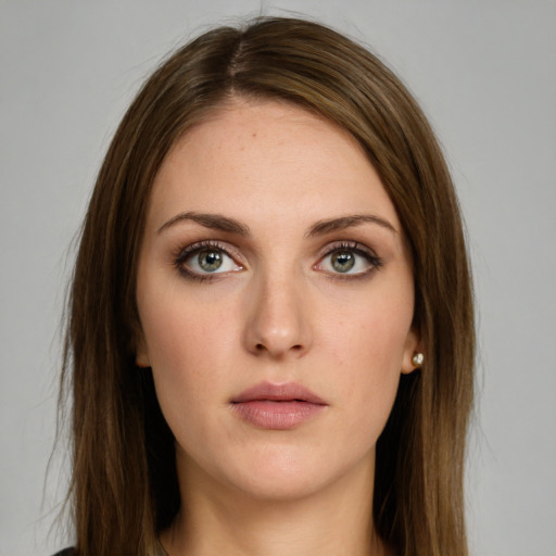 Neutral white young-adult female with long  brown hair and green eyes