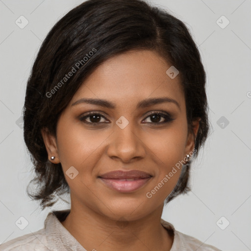 Joyful black young-adult female with medium  brown hair and brown eyes