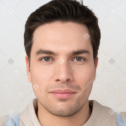 Neutral white young-adult male with short  brown hair and brown eyes