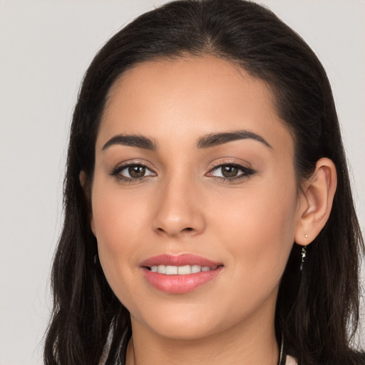 Joyful white young-adult female with long  brown hair and brown eyes