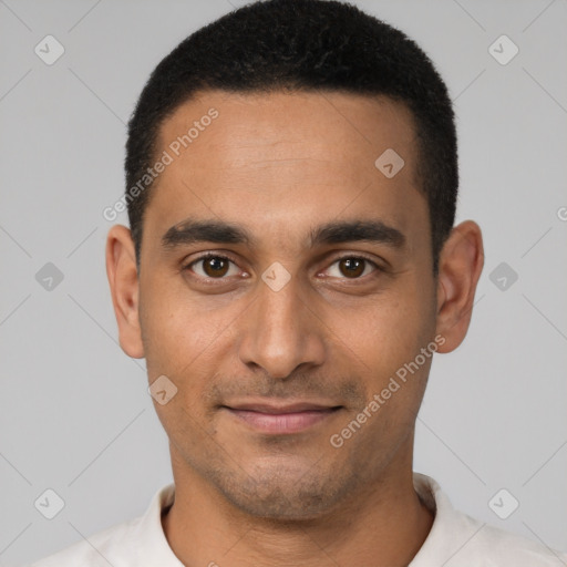 Joyful latino young-adult male with short  brown hair and brown eyes