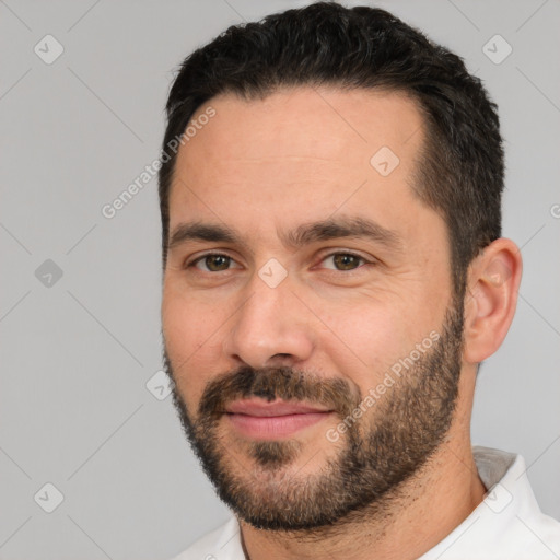 Joyful white young-adult male with short  black hair and brown eyes