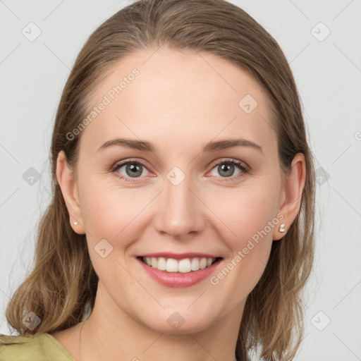 Joyful white young-adult female with medium  brown hair and grey eyes