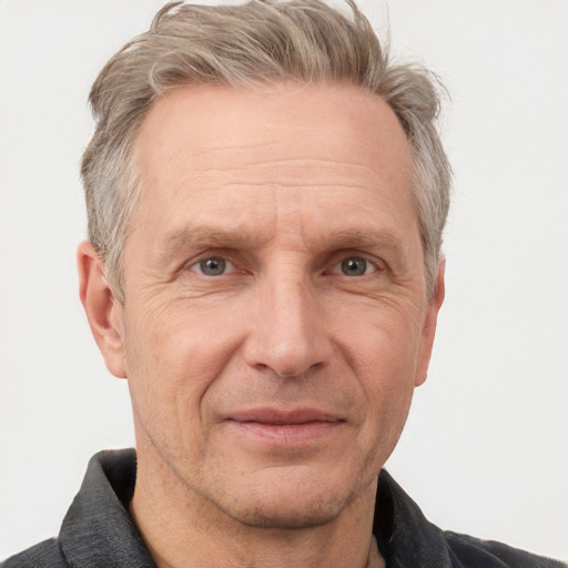 Joyful white middle-aged male with short  gray hair and grey eyes