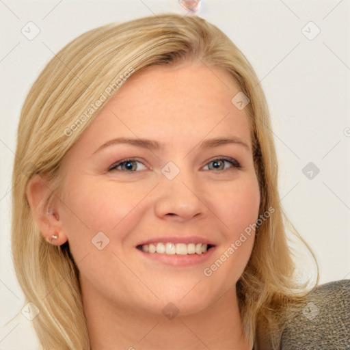 Joyful white young-adult female with long  brown hair and blue eyes