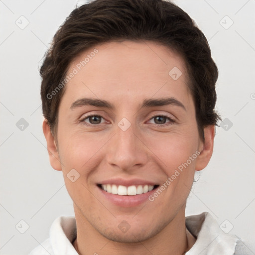 Joyful white young-adult female with short  brown hair and brown eyes