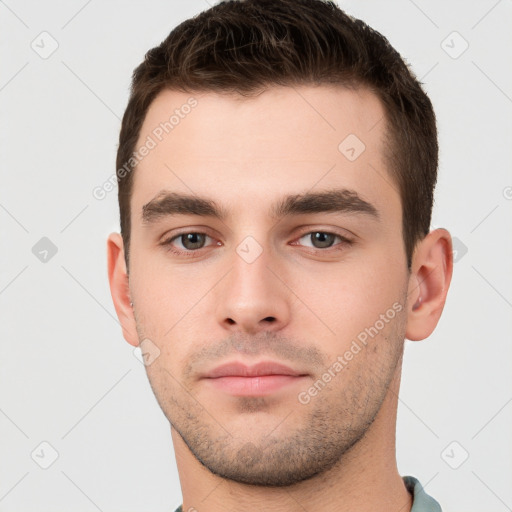 Neutral white young-adult male with short  brown hair and brown eyes