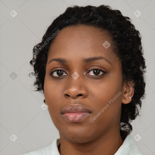 Neutral black young-adult female with short  black hair and brown eyes