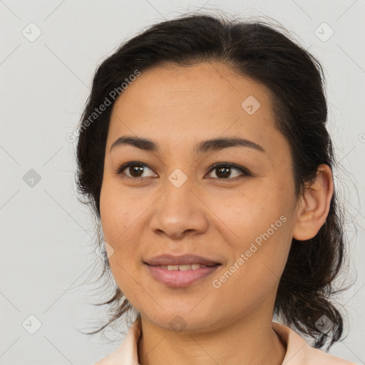 Joyful latino young-adult female with medium  brown hair and brown eyes