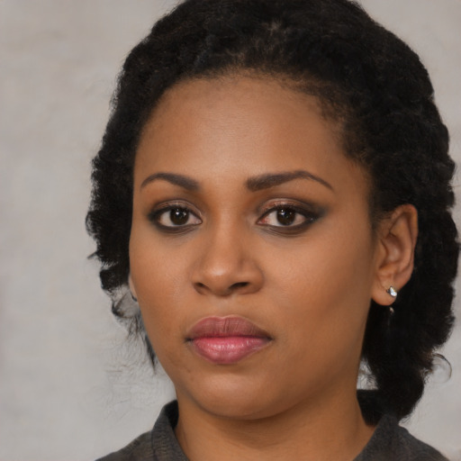Neutral black young-adult female with medium  black hair and brown eyes