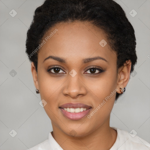 Joyful black young-adult female with short  brown hair and brown eyes