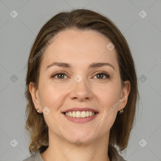 Joyful white young-adult female with medium  brown hair and grey eyes