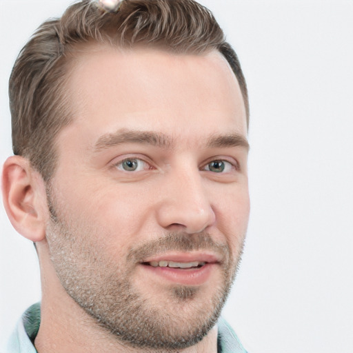 Joyful white young-adult male with short  brown hair and blue eyes