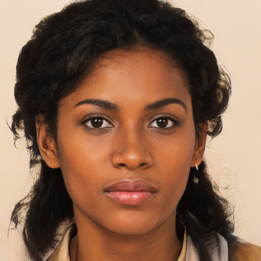 Neutral black young-adult female with long  brown hair and brown eyes