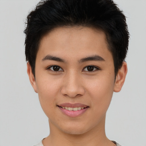 Joyful asian young-adult female with short  brown hair and brown eyes