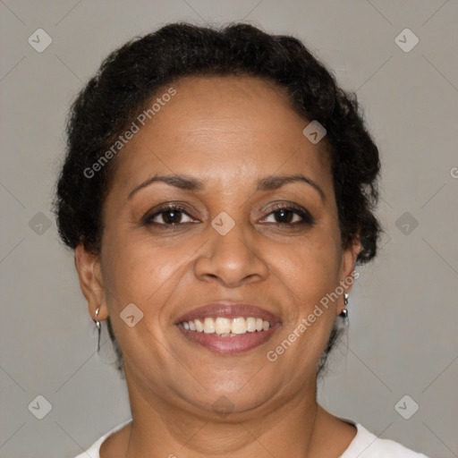 Joyful black adult female with short  brown hair and brown eyes