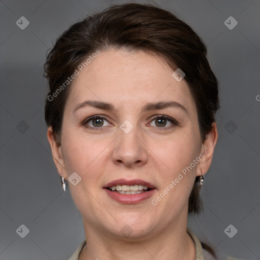 Joyful white adult female with short  brown hair and grey eyes