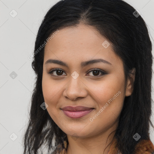 Joyful latino young-adult female with long  brown hair and brown eyes