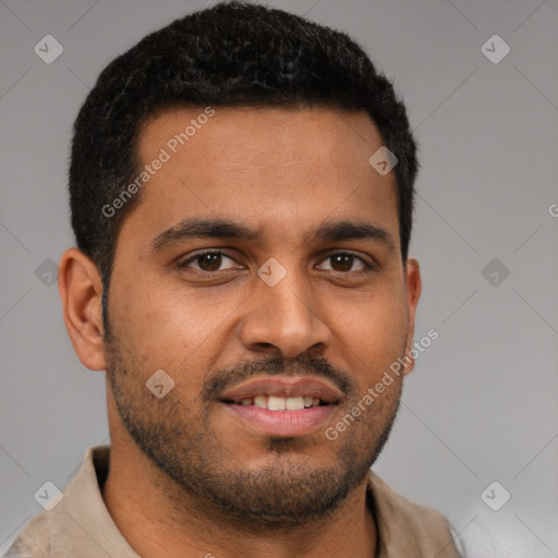 Joyful black young-adult male with short  brown hair and brown eyes