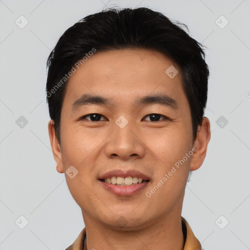 Joyful asian young-adult male with short  black hair and brown eyes