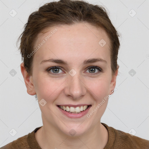 Joyful white young-adult female with short  brown hair and grey eyes