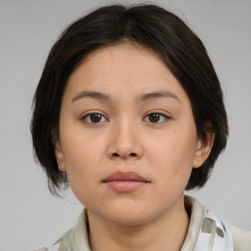 Neutral asian young-adult female with medium  brown hair and brown eyes