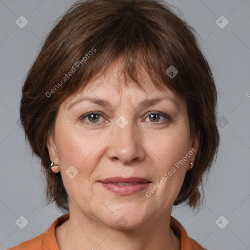 Joyful white adult female with medium  brown hair and brown eyes