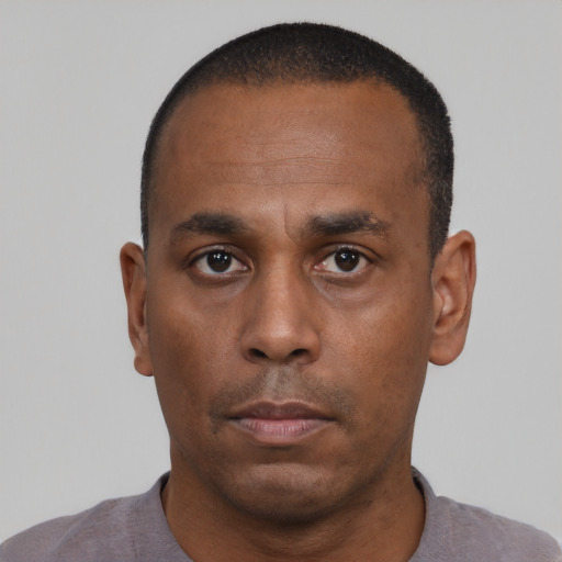 Neutral black adult male with short  black hair and brown eyes