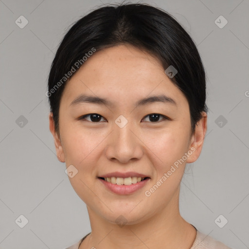 Joyful asian young-adult female with short  brown hair and brown eyes