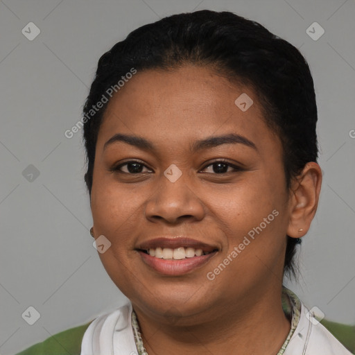 Joyful latino young-adult female with short  black hair and brown eyes