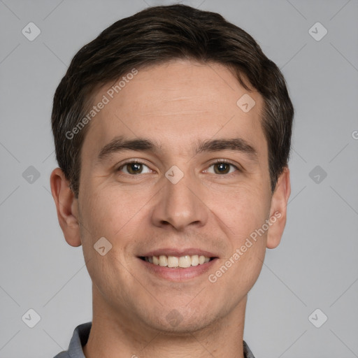 Joyful white adult male with short  brown hair and grey eyes