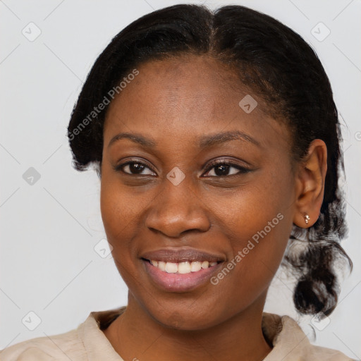 Joyful black young-adult female with medium  brown hair and brown eyes