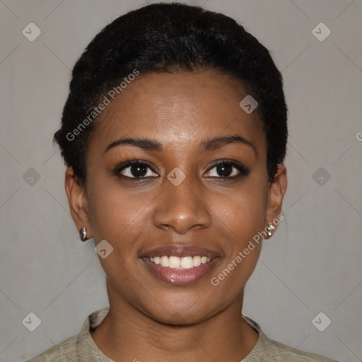 Joyful black young-adult female with short  black hair and brown eyes