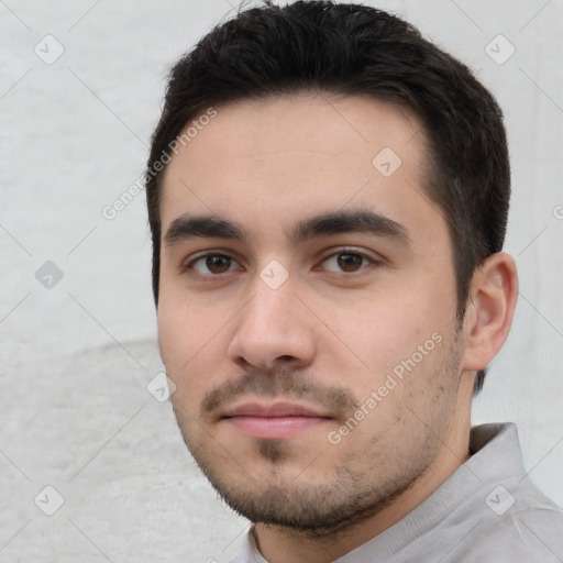 Neutral white young-adult male with short  black hair and brown eyes