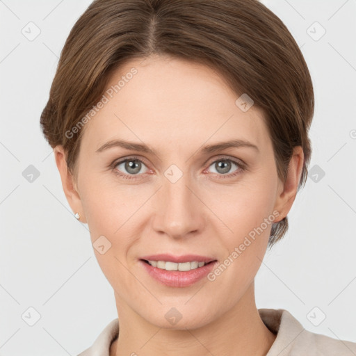 Joyful white young-adult female with short  brown hair and grey eyes